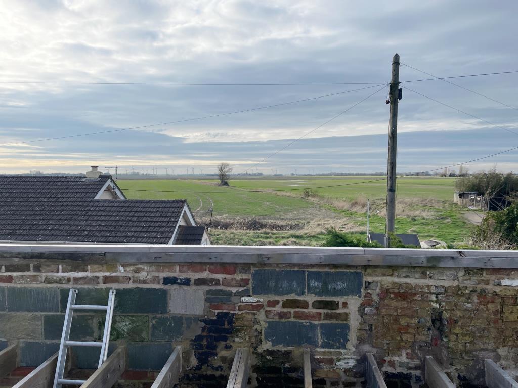 Lot: 58 - COTTAGE RENOVATION PROJECT WITH PLANNING IN VILLAGE LOCATION - View to the front of the property across the Fenns